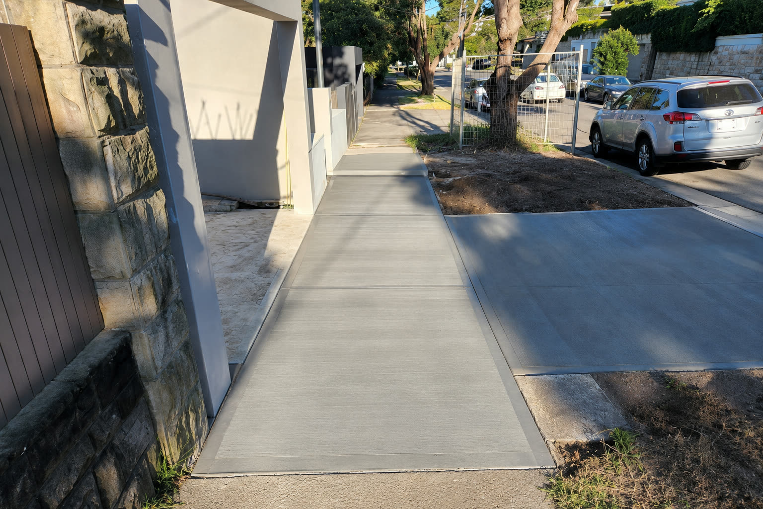 Concrete footpath alongside a Sydney property