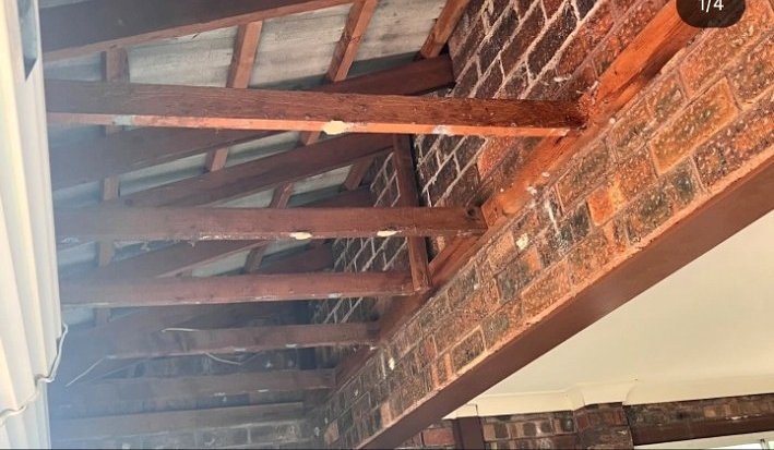 Exposed roof beams before ceiling work
