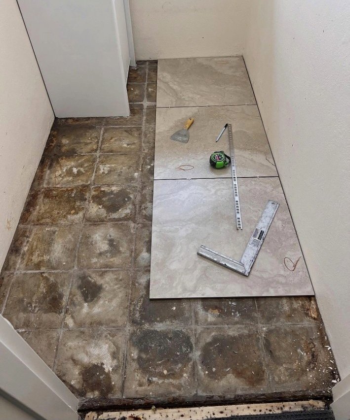 Laundry floor tiling in progress